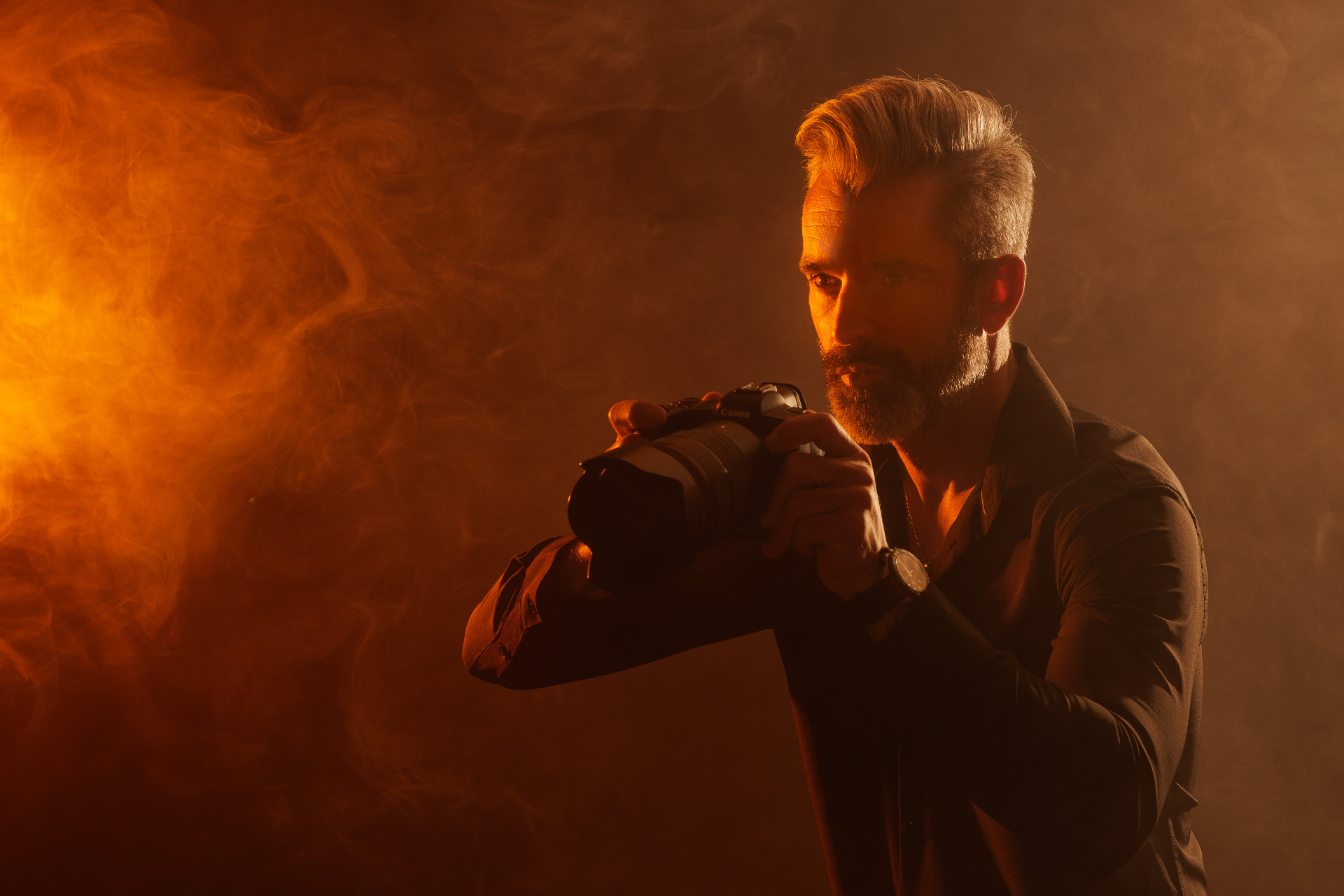 Photographer portrait in orange smoke